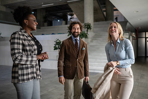 istock Diverse business team laughing during office conversation 2244763356