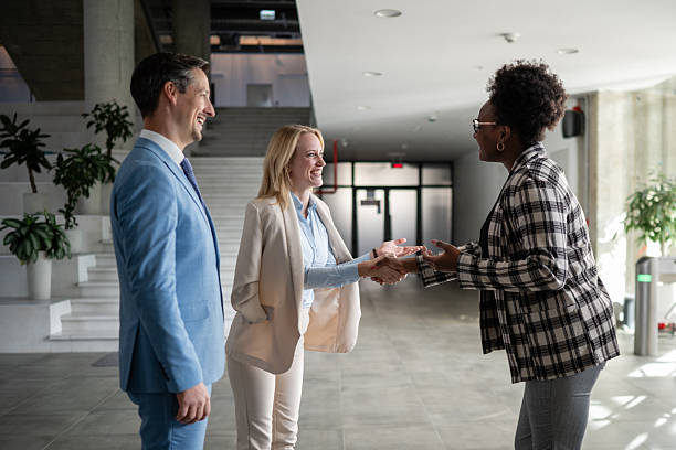 istock Business people shaking hands at office meeting 2244763419