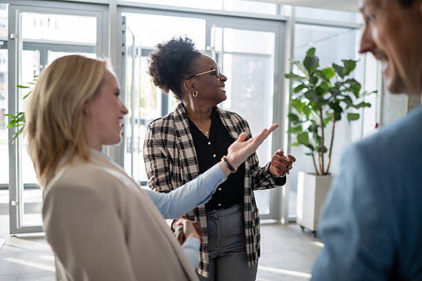 istock Diverse business people talking happily during office break 2244763608