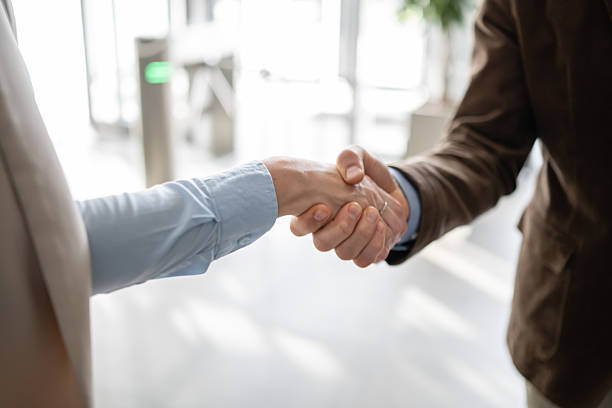istock Business people shaking hands making deal partnership 2244763775