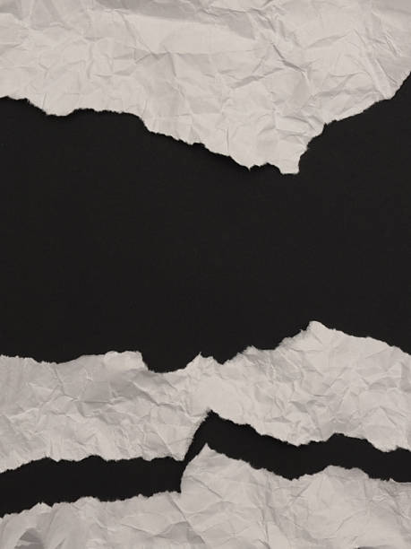 istock Torn, ripped paper pieces wave crack frame. Black, white copy space texture poster background. 2244766343