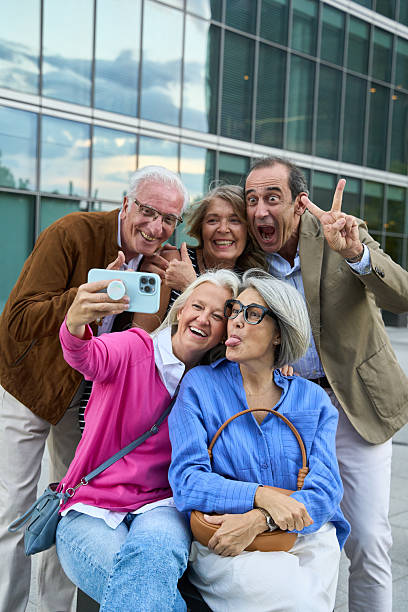 istock Senior friends taking a fun selfie with smartphone 2244766988