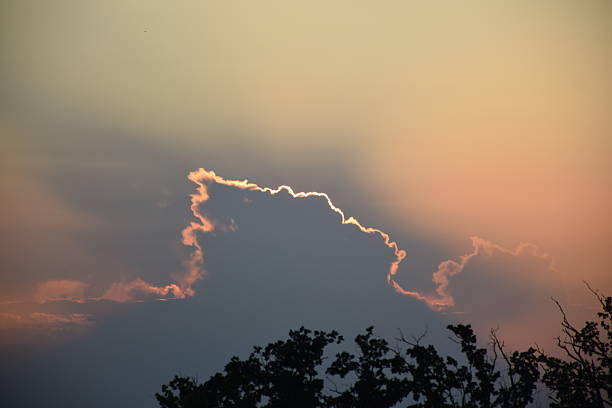 istock Dramatic sunset sky with vibrant hues illuminating fluffy clouds, creating a stunning visual display of nature's beauty and tranquility in the evening atmosphere 2244767633