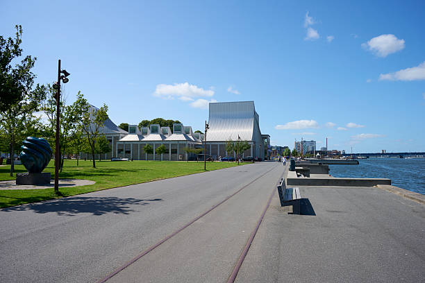 The striking Moesgaard Museum in Beder, a suburb of Aarhus in eastern Jutland, Denmark. Moesgaard Museum (MOMU) is a regional museum with displays of ethnography and archaeology with open-air exhibits. Small robotic lawnmowers keep the grass-covered sloping roof in a neat condition.
