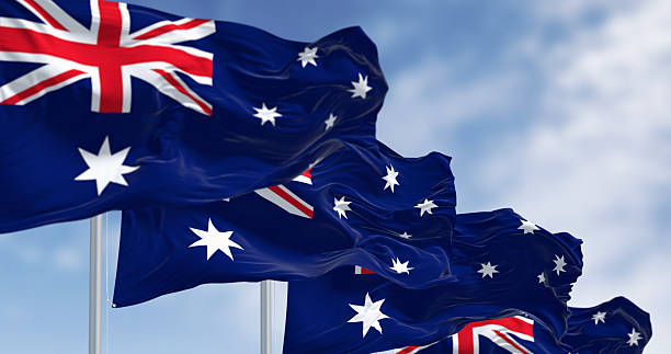 istock Australia national flags waving in the wind on a clear day 2244769192