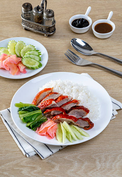Barbecue roasted duck on rice  on the wooden table