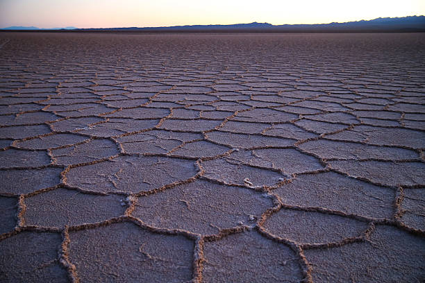 istock Cracked earth pattern in dry desert 2244771306
