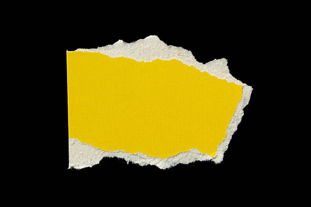 istock Ripped yellow paper torn edges isolated on black background 2244771970
