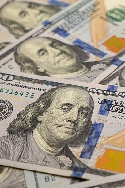 istock Hundred Dollar Bills Background – US Currency Money Texture 2244773579
