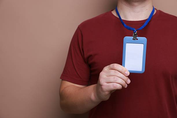 istock Man with blank badge on brown background, closeup. Space for text 2244773687