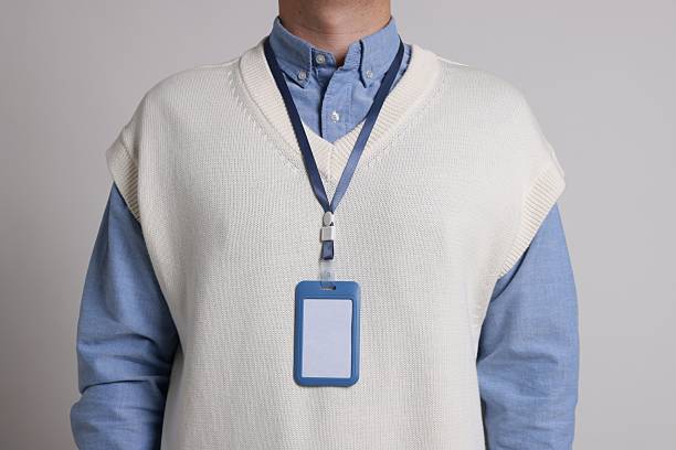 istock Man with blank badge on gray background, closeup 2244773727