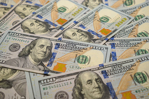 istock Hundred Dollar Bills Background – US Currency Money Texture 2244773728