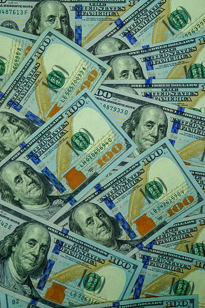 istock Hundred Dollar Bills Background – US Currency Money Texture 2244773877
