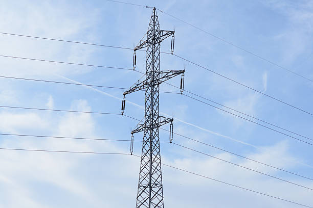 istock High-Voltage Power Transmission Tower against Blue Sky 2244775109