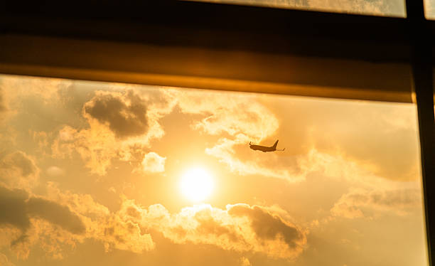 istock Sunset view of airplane flying from the window 2244775479