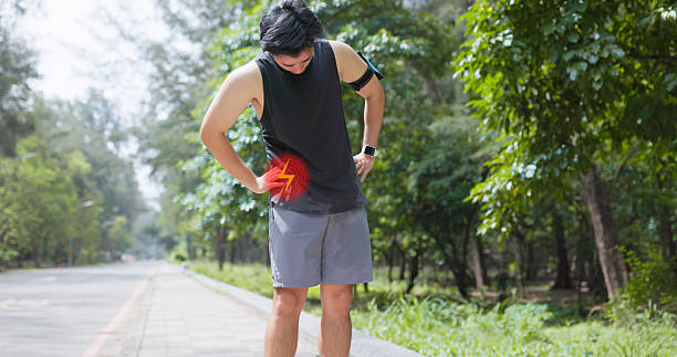 istock asian man exercise sprain waist 2244775706