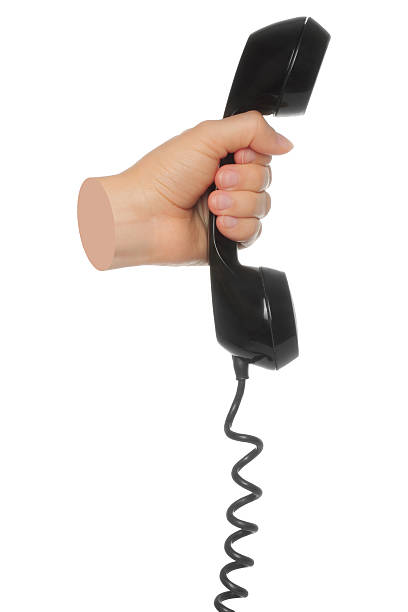 istock Hand holds classic telephone handset, isolated on transparent background, retro technology concept. Contemporary art 2244777045