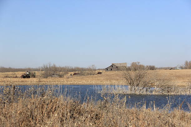 Abandoned farms and falling buildings and scenery on the prairies.
