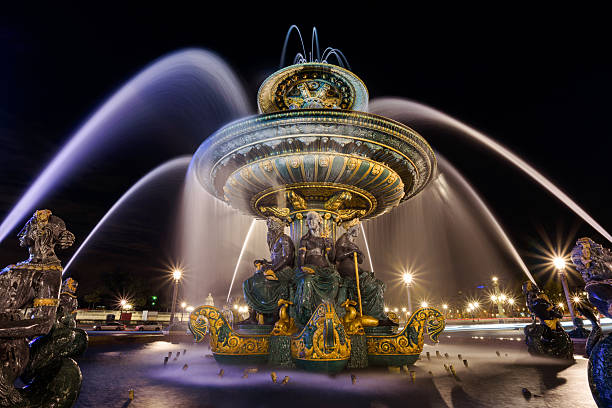 The Fountain of River Commerce and Navigation at night, located in the Place de la Concorde in the center of Paris.