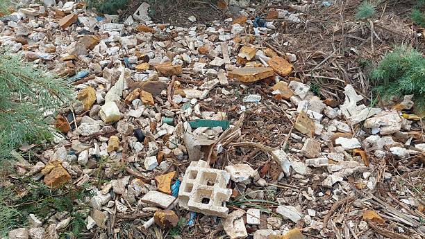 istock Polluted natural area with mixed industrial debris and environmental waste accumulation 2244780189