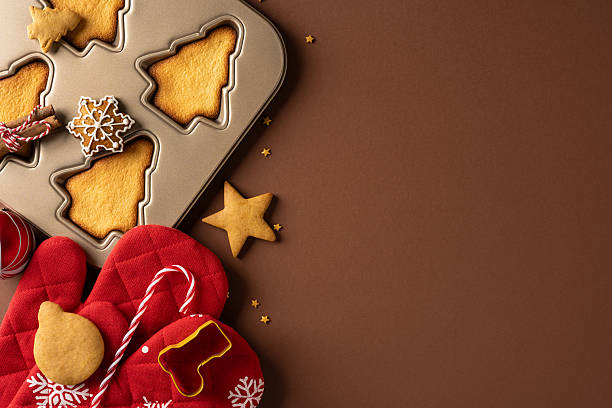 istock Decorative cookie tin with tree shaped cookies, candy canes, and red mittens evokes a warm holiday scene perfect for Christmas and New Year greetings and festive moments 2244780532