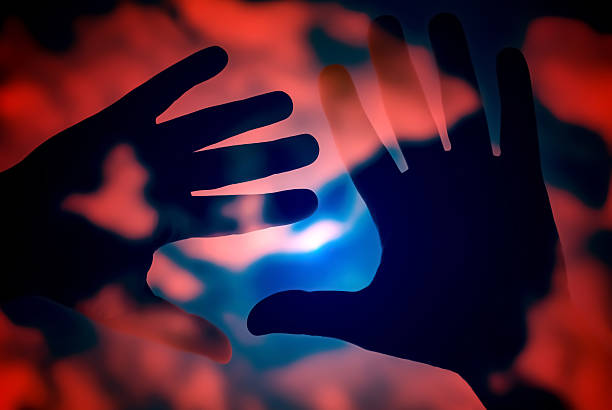 Close-Up Of Human Hand On Glass Window