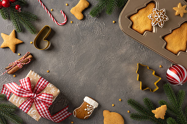 istock A top view warm holiday arrangement features cookies, a baking tray, wrapped gift, candy canes, and pine branches, conveying festive joy and seasonal spirit for Christmas and New Year 2244780621