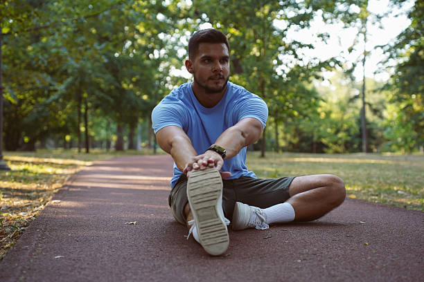istock Young athletic man stretching in the park 2244781858