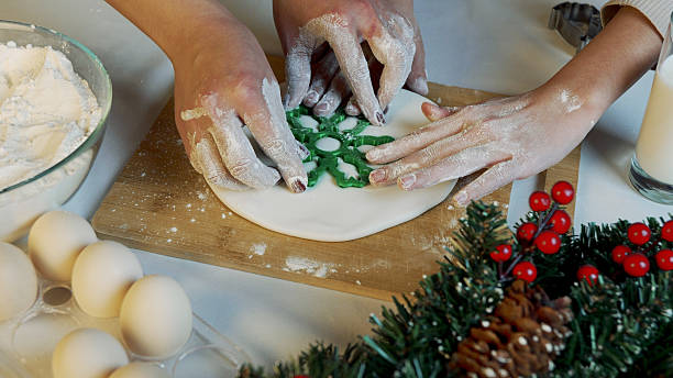 istock mom and daughter making Christmas sweets 2244782050