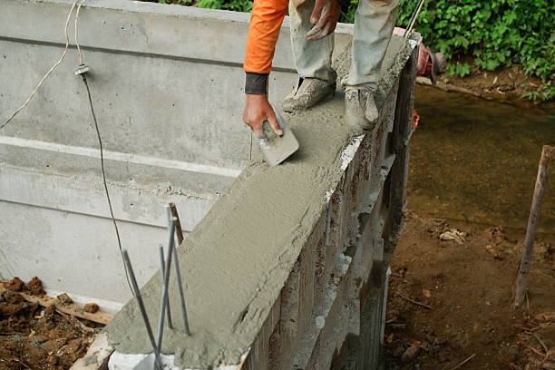 istock Reinforcement Steel Rebar Cage and Concrete Wall Foundation during Construction. Structural Engineering Detail. 2244785295
