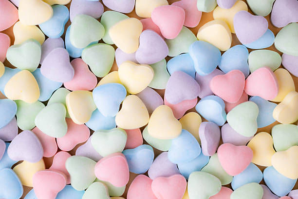 istock Pastel candy conversation hearts Valentine's Day background 2244790373