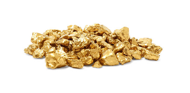 istock Heap of gold nuggets isolated on white 2244790394
