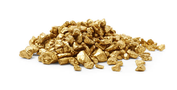 istock Heap of gold nuggets isolated on white 2244790399