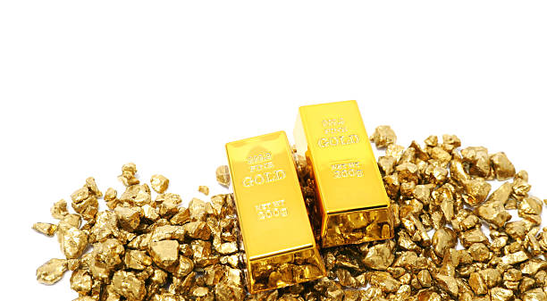 istock Gold nuggets and bars isolated on white 2244790424