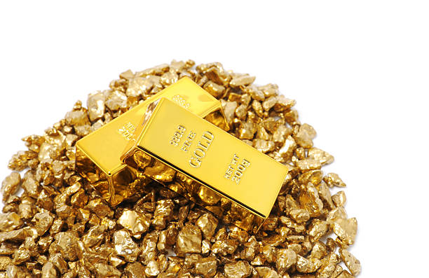istock Gold nuggets and bars isolated on white 2244790651