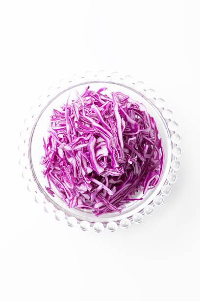 Shredded purple cabbage on a white background