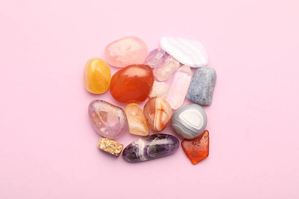 istock Beautiful natural gemstones on light pink background, flat lay 2244795354