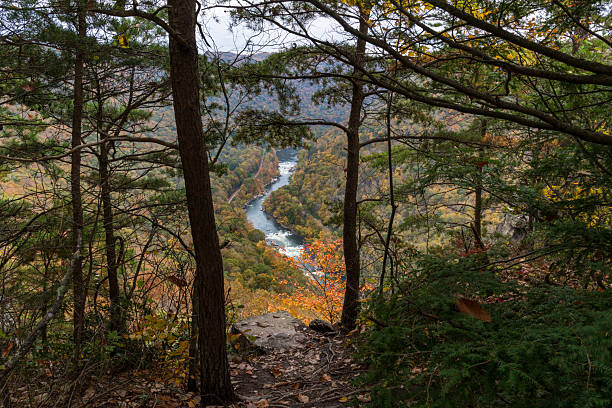 istock Autumn View of a Winding River Through Forested Hills 2244797309