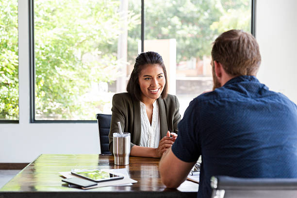 istock Diverse colleagues collaborate in a modern office setting, discussing ideas and sharing insights. 2244799455