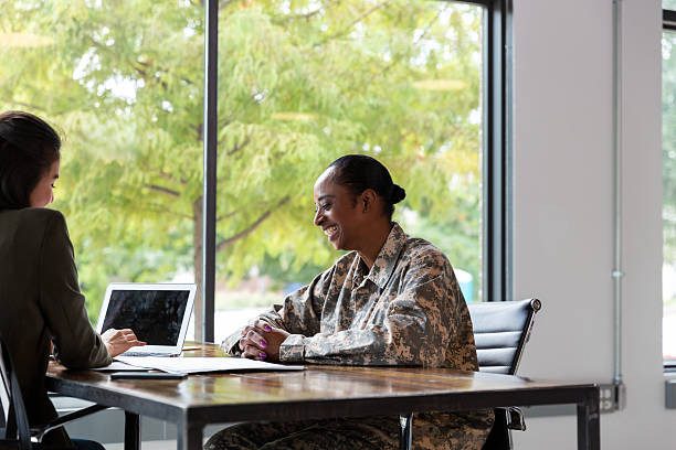 istock Two women discuss plans while using a laptop in a brightly lit office space. 2244799474