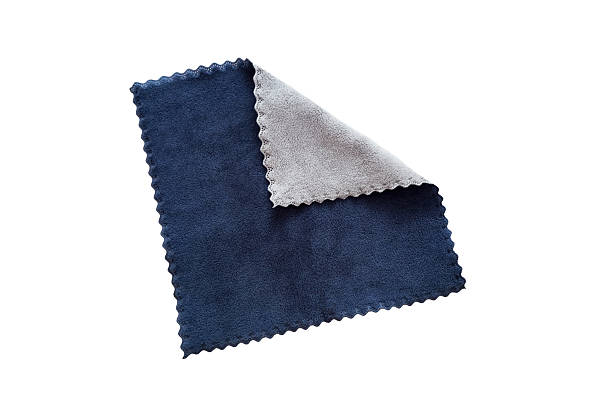 istock A two-color blue and gray napkin with a wavy edge. The corner is folded back. On a white isolated background. 2244799893