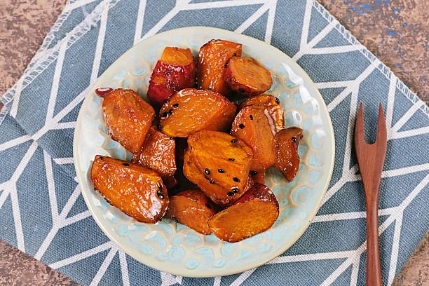 istock Daigaku Imo Japanese Caramelized Sweet Potatoes on grey Napkin 2244800449