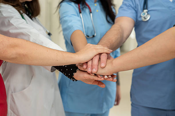 istock High five, doctors in a medical team stacking hands,  collaboration and support in a hospital 2244802395