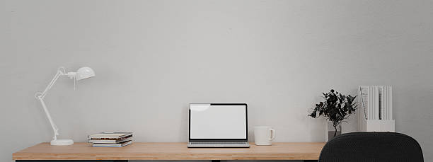 istock 3D render workspace laptop on wooden table with office supply 2244805938