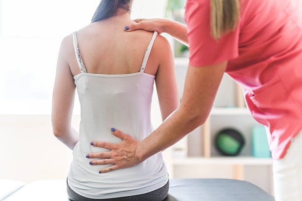 istock Modern rehabilitation physiotherapy clinic with professional and client 2244806335
