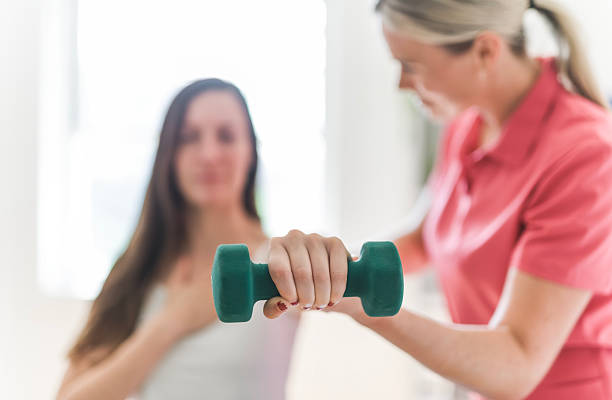 istock Modern rehabilitation physiotherapy clinic with professional and client 2244806348