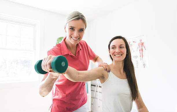 istock Modern rehabilitation physiotherapy clinic with professional and client 2244806353