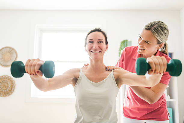istock Modern rehabilitation physiotherapy clinic with professional and client 2244806378