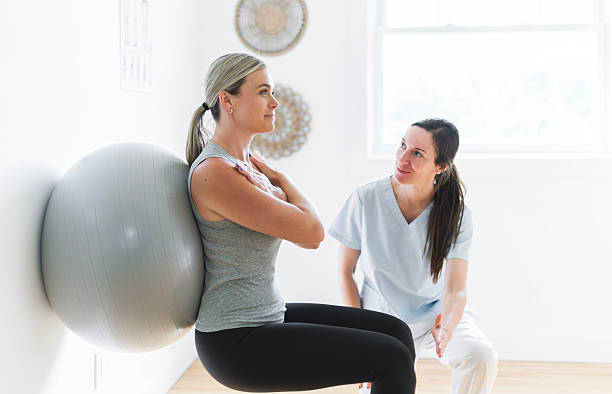 istock Modern rehabilitation physiotherapy clinic with professional and client 2244806408