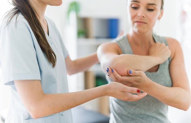 istock Modern rehabilitation physiotherapy clinic with professional and client 2244806432